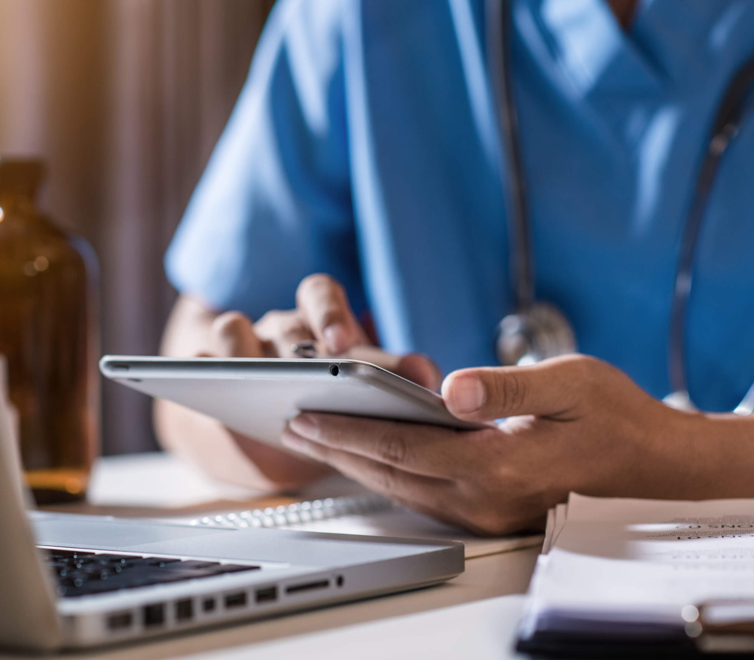the-doctor-is-working-on-a-tablet-and-audio-player-2022-10-31-23-46-14-utcv1 the doctor is working on a tablet
